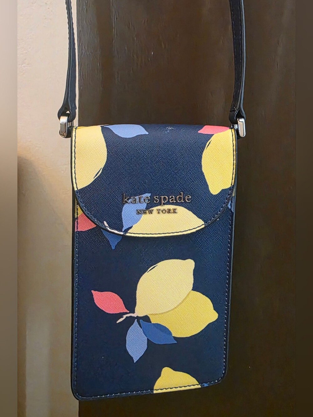 Kate Spade navy floral crossbody phone pouch with yellow and pink accents
